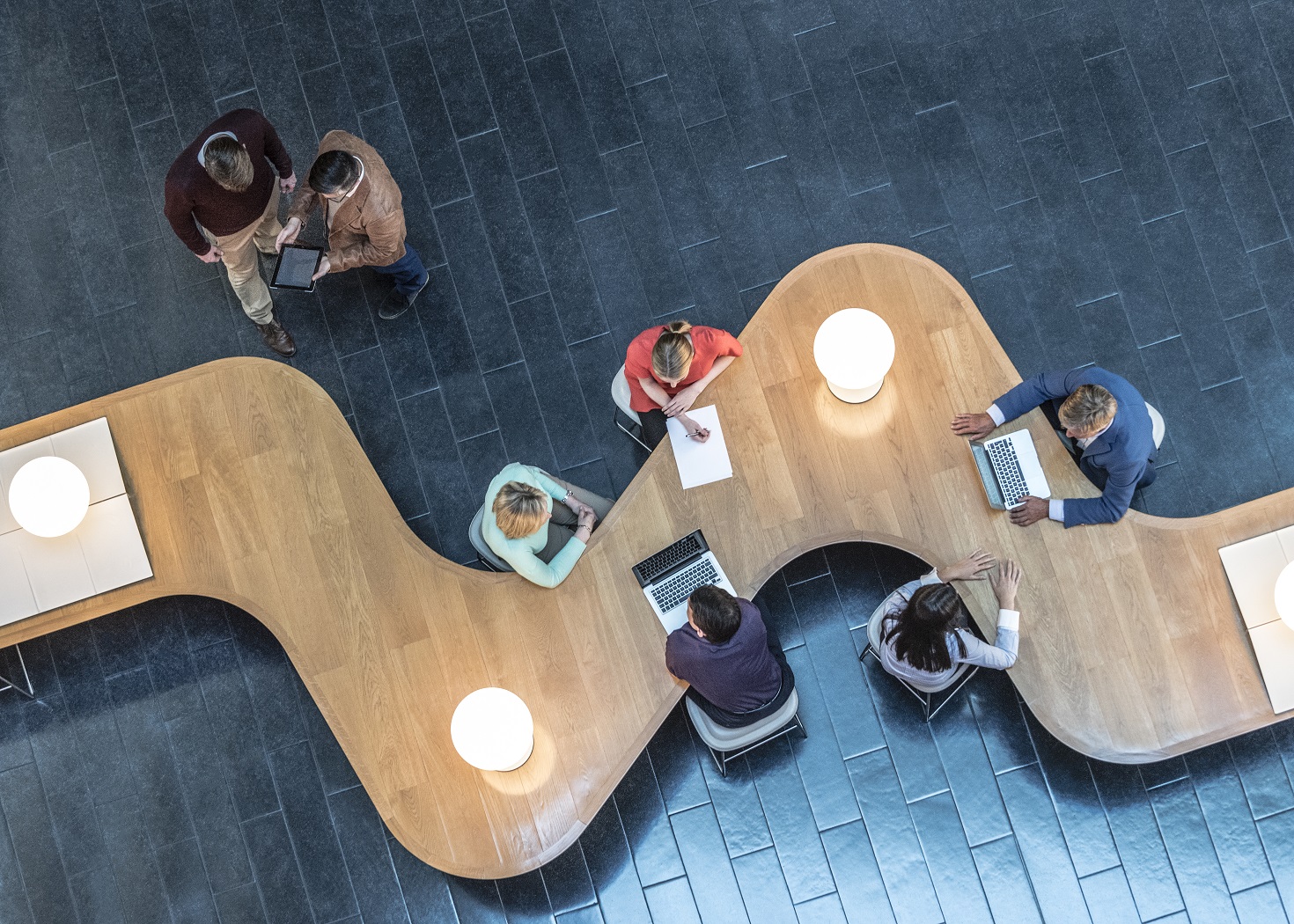 Business people meeting in modern office, view from above